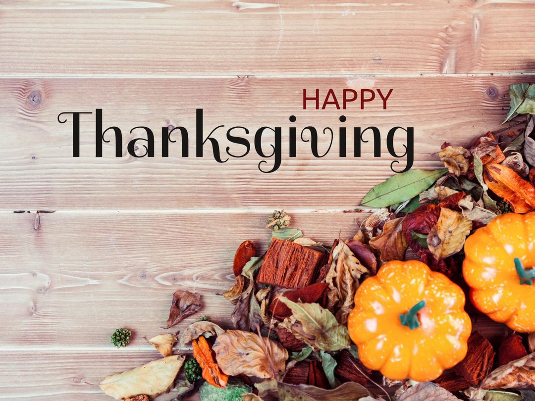 Autumn Leaves and Pumpkins with Happy Thanksgiving Text