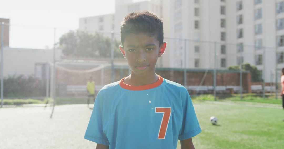 Confident Young Soccer Player in Blue Jersey - Free Images, Stock Photos and Pictures on Pikwizard.com