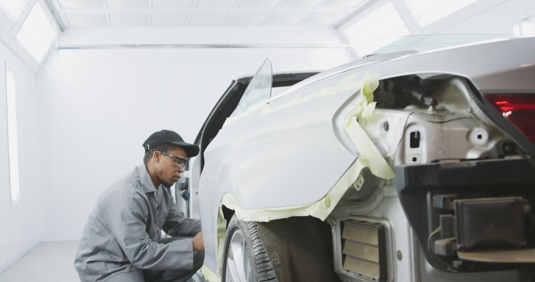 Auto Mechanic Repairing Car Body in Garage - Free Images, Stock Photos and Pictures on Pikwizard.com