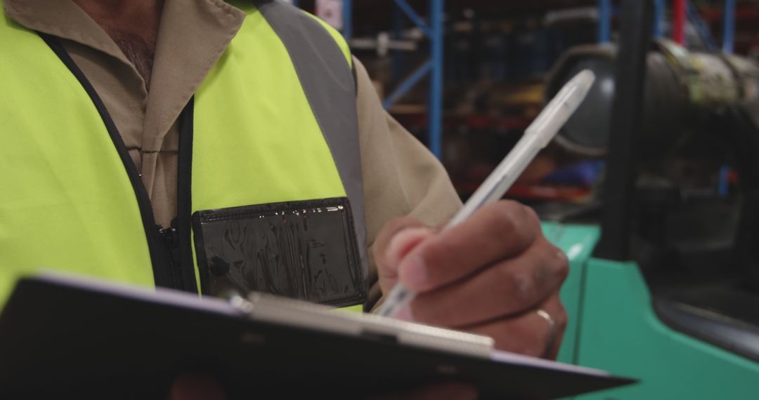 Warehouse Worker Recording Data on Clipboard - Free Images, Stock Photos and Pictures on Pikwizard.com