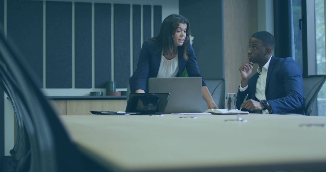 Professional Team Collaborating in Modern Boardroom