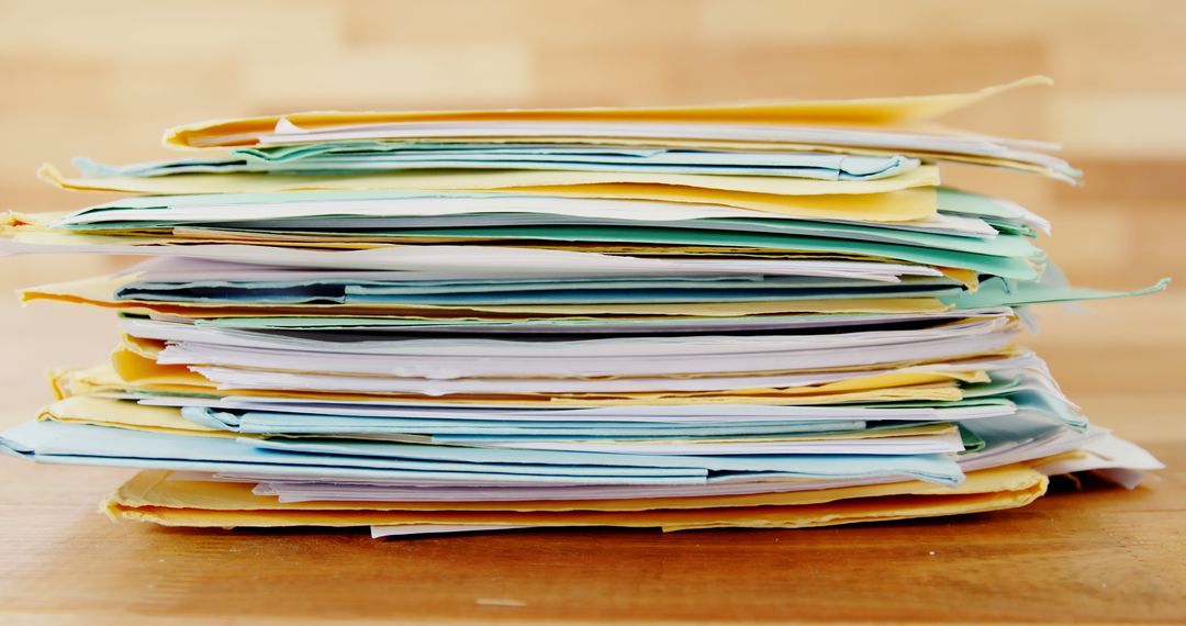 Stack of Colorful Documents on Wooden Desk - Free Images, Stock Photos and Pictures on Pikwizard.com