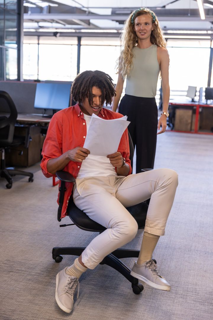Diverse Team Collaborating in Modern Open-Plan Office