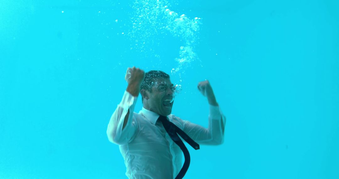 Businessman triumphing underwater in swimming pool - Free Images, Stock Photos and Pictures on Pikwizard.com