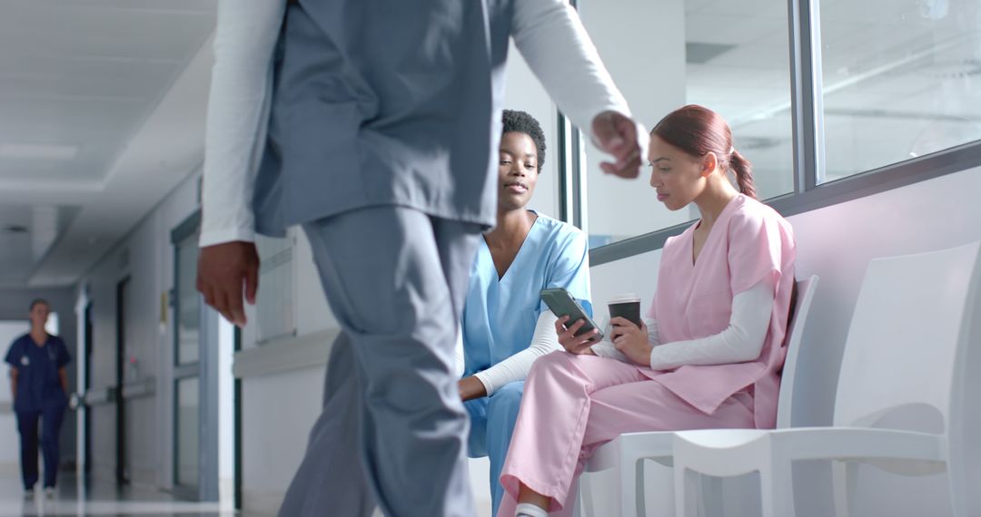 Hospital Staff Taking a Break in Hallway - Free Images, Stock Photos and Pictures on Pikwizard.com