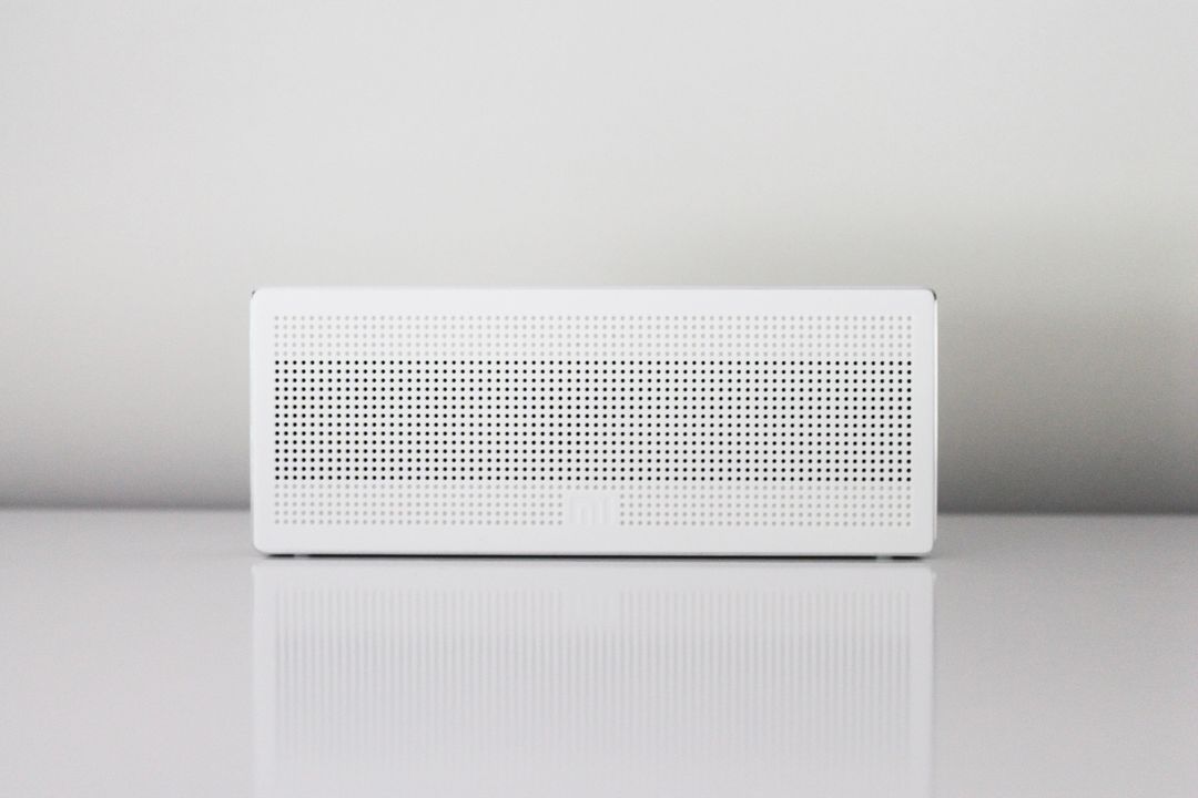 Minimalist Bluetooth Speaker on White Surface - Free Images, Stock Photos and Pictures on Pikwizard.com