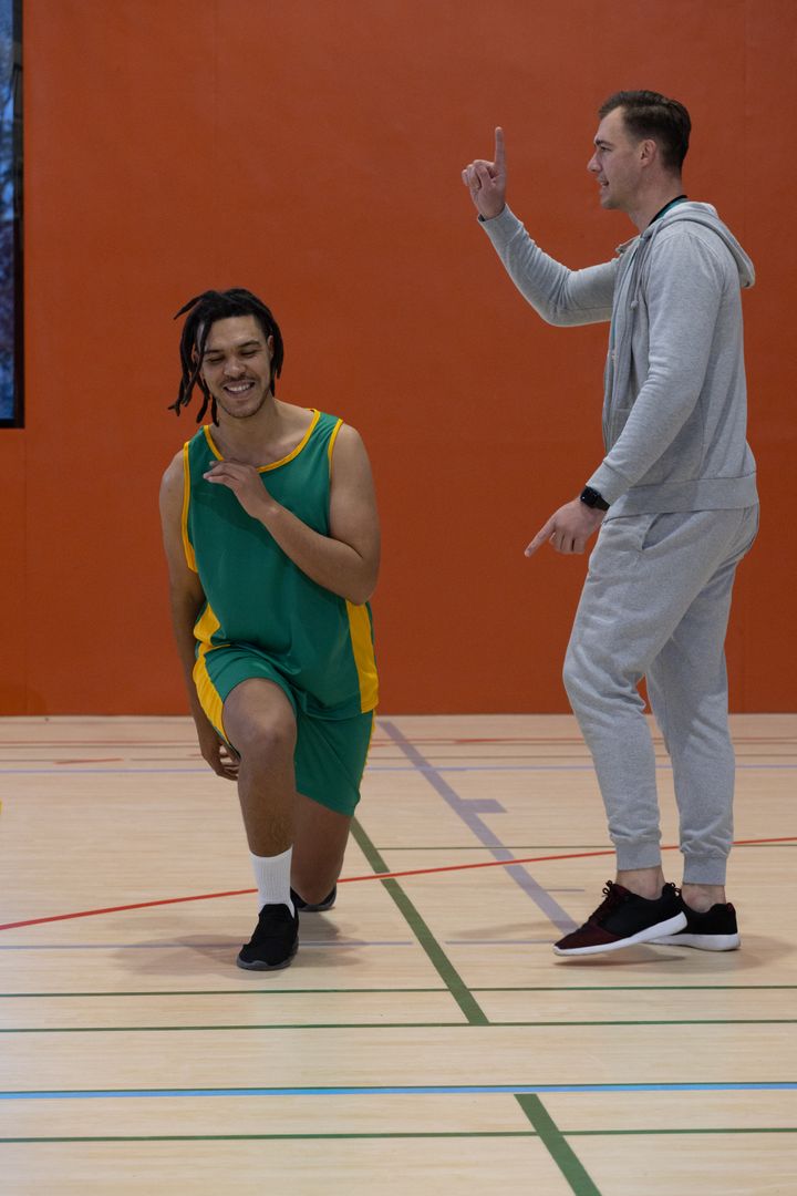 Coach and Young Basketball Player Engaging in Training Session