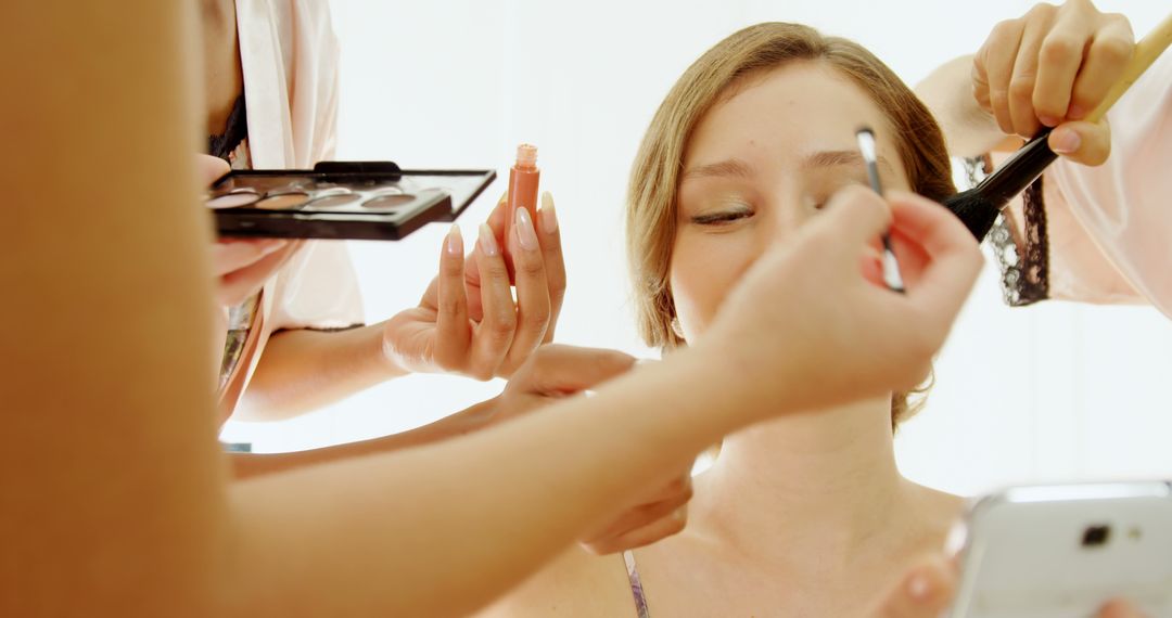 Woman Preparing for Event with Professional Makeup Application