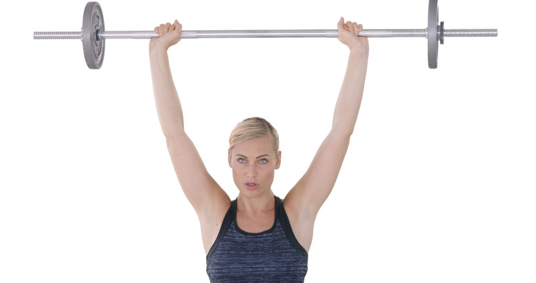 Woman Lifting Barbell Overhead in Fitness Training - Free Images, Stock Photos and Pictures on Pikwizard.com