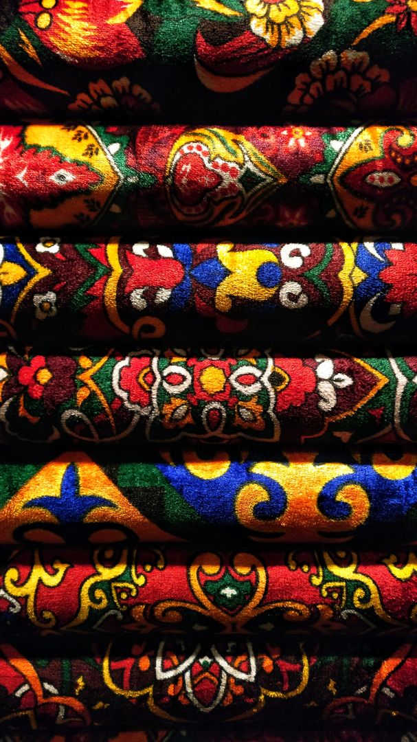 Stack of Vibrant Traditional Fabrics with Intricate Patterns - Free Images, Stock Photos and Pictures on Pikwizard.com