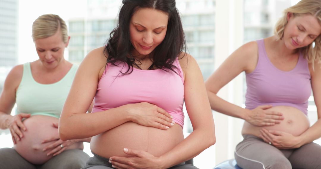 Pregnant Women Practicing Prenatal Yoga on Exercise Balls - Free Images, Stock Photos and Pictures on Pikwizard.com