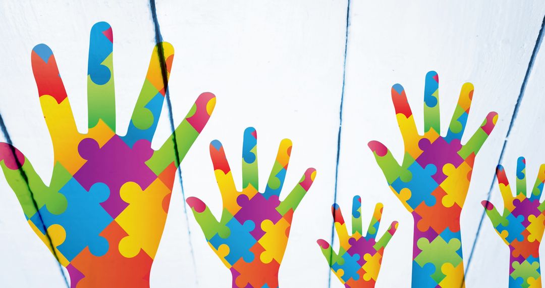 Colorful Puzzle Hands Symbolizing Autism Awareness