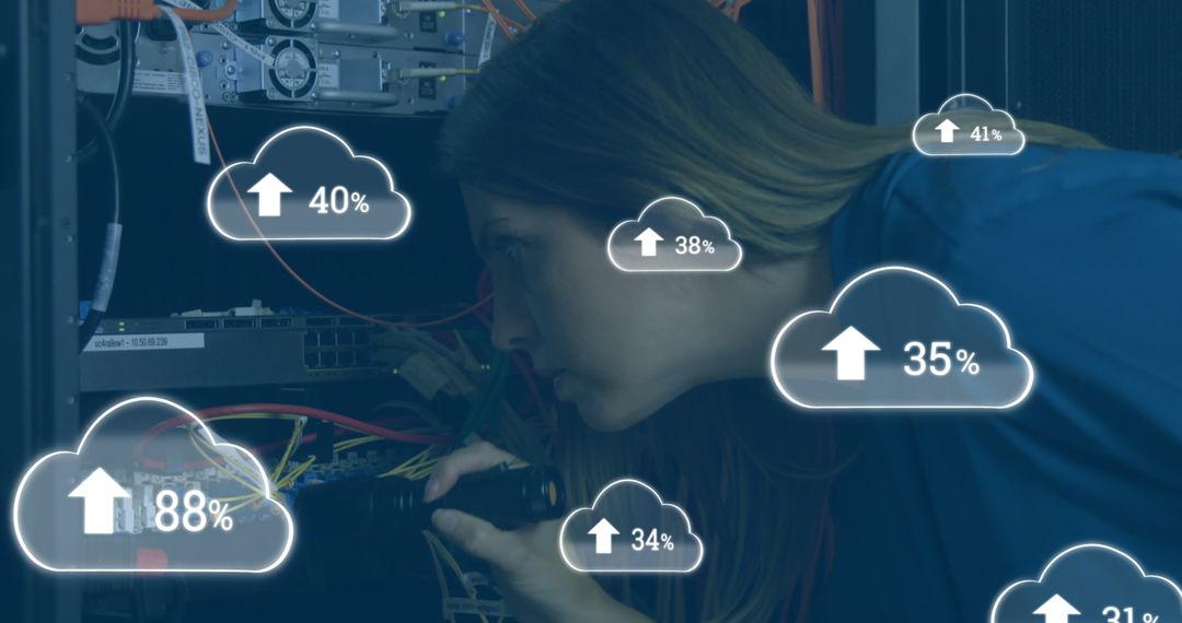 Female Technician Monitoring Cloud Analytics in Server Room
