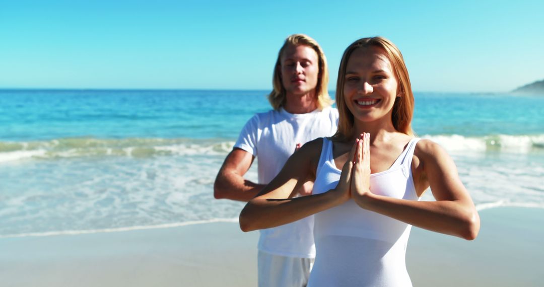 Couple Practicing Yoga on Peaceful Beach - Free Images, Stock Photos and Pictures on Pikwizard.com