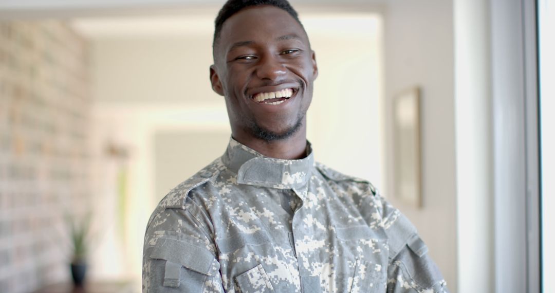 African American Male Soldier Smiling in Camouflage Uniform at Home - Free Images, Stock Photos and Pictures on Pikwizard.com