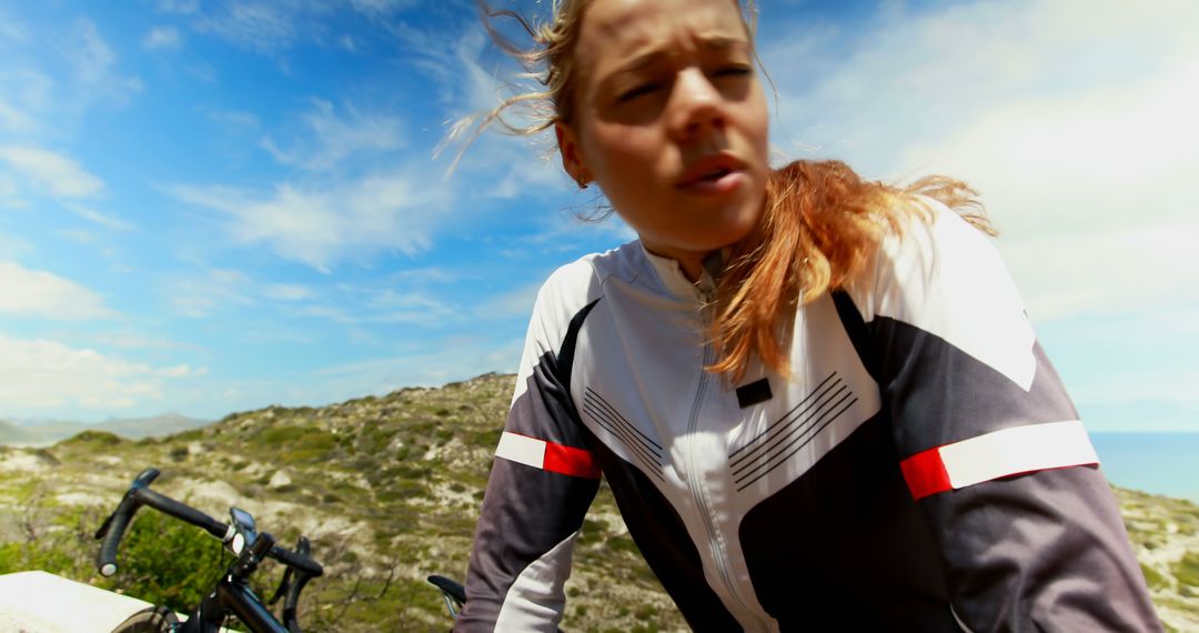 Female Cyclist Resting on Mountain Road - Free Images, Stock Photos and Pictures on Pikwizard.com