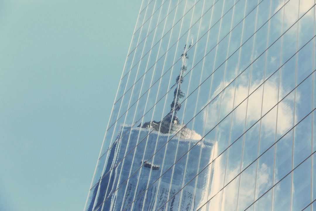 Reflection of Modern Skyscraper on Glass Building Facade - Free Images, Stock Photos and Pictures on Pikwizard.com