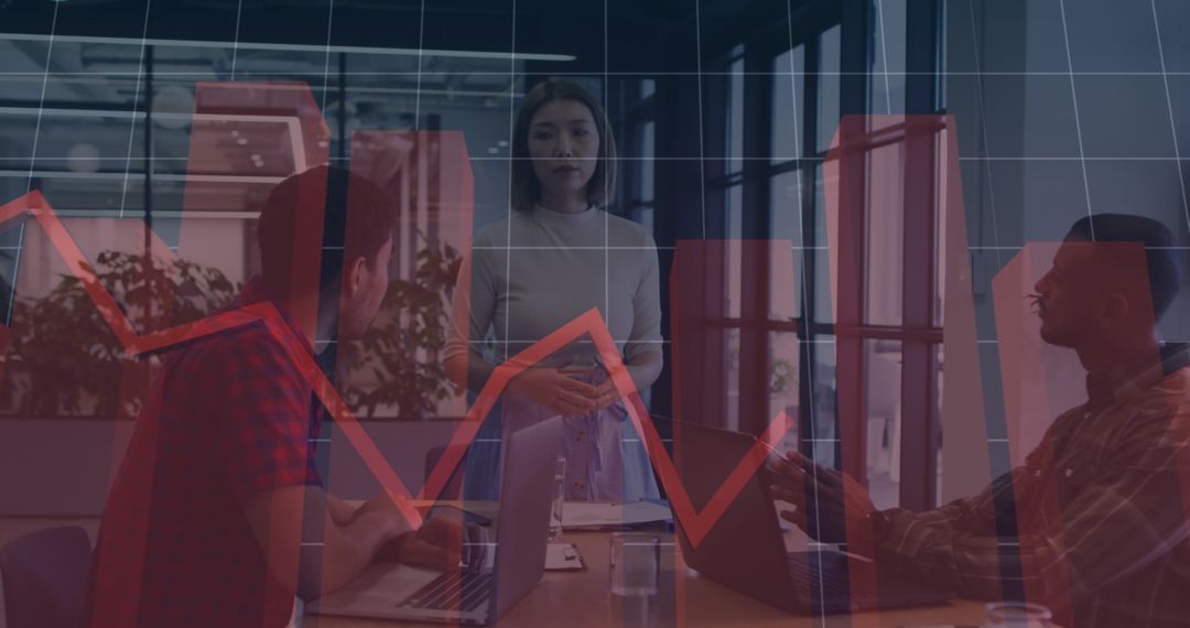 Diverse Team Analyzing Financial Data with Chart Overlay in Modern Office
