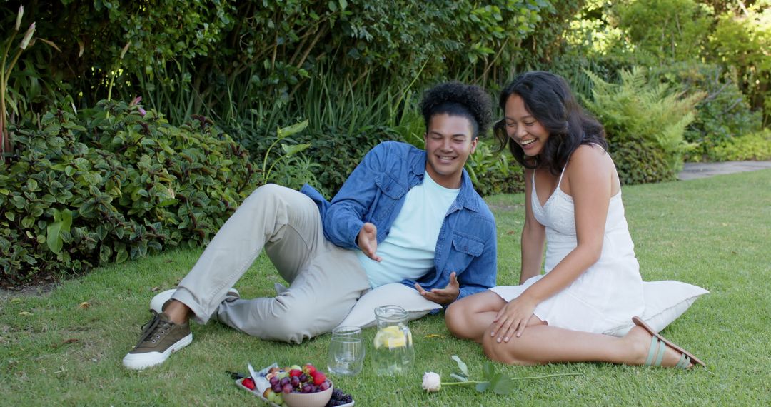 Smiling Couple Enjoying Leisurely Picnic Enveloped in Nature's Beauty