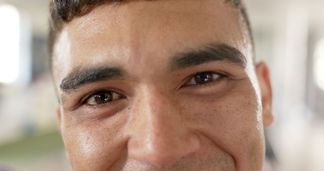 Smiling Man in Close-Up Portrait with Empowering Gaze
