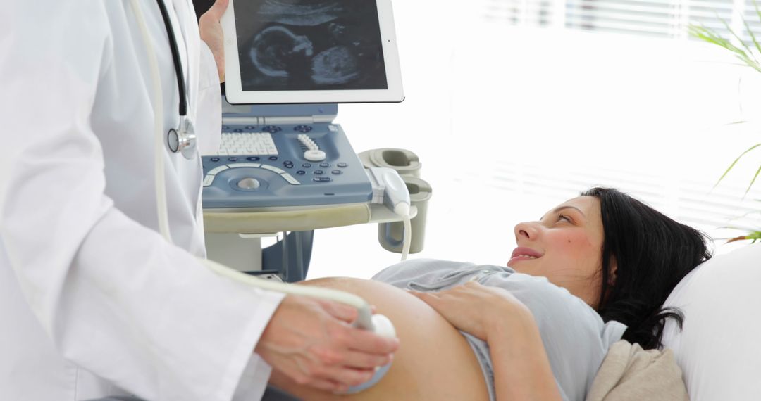 Pregnant Woman Undergoing Ultrasound Examination at Clinic - Free Images, Stock Photos and Pictures on Pikwizard.com