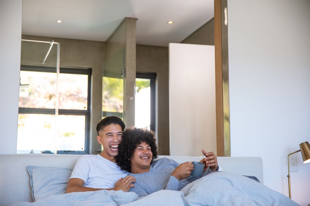 Cozy Diverse Couple Relaxing with Coffee at Home
