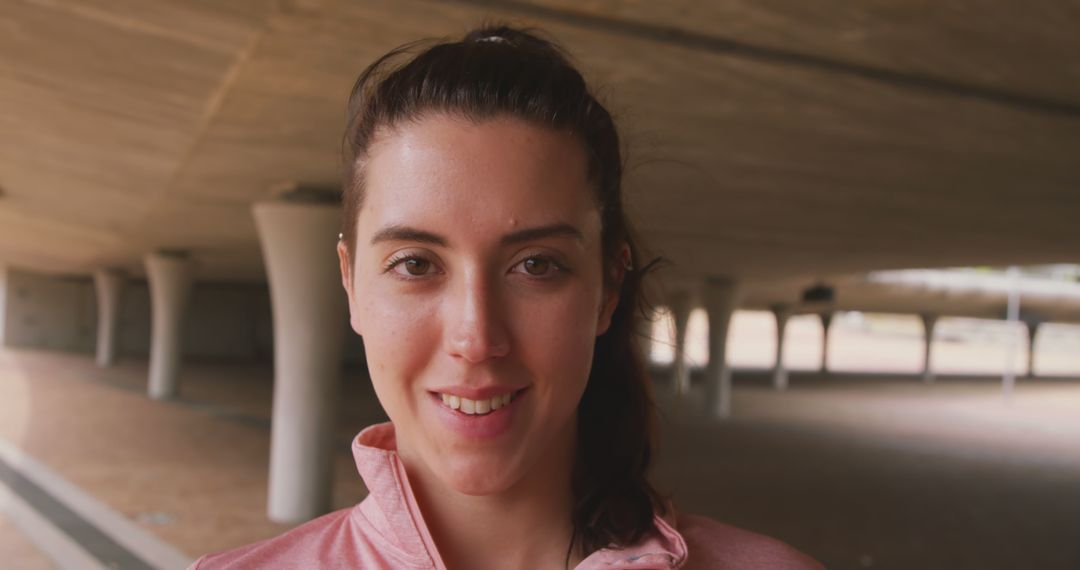 Smiling Biracial Woman in Architectural Outdoor Setting