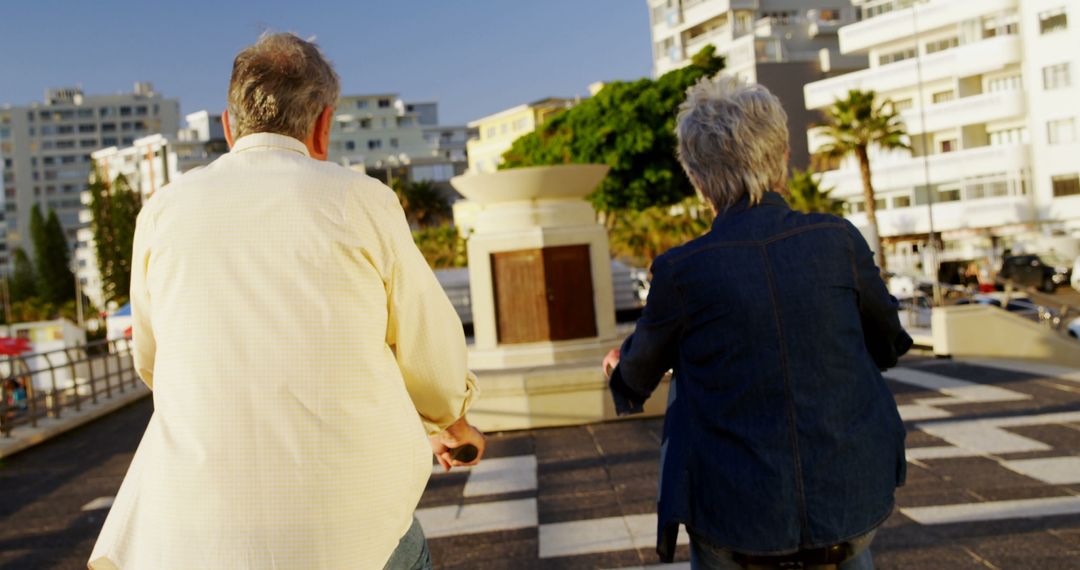 Senior Couple Enjoying City Walk on Sunny Day - Free Images, Stock Photos and Pictures on Pikwizard.com