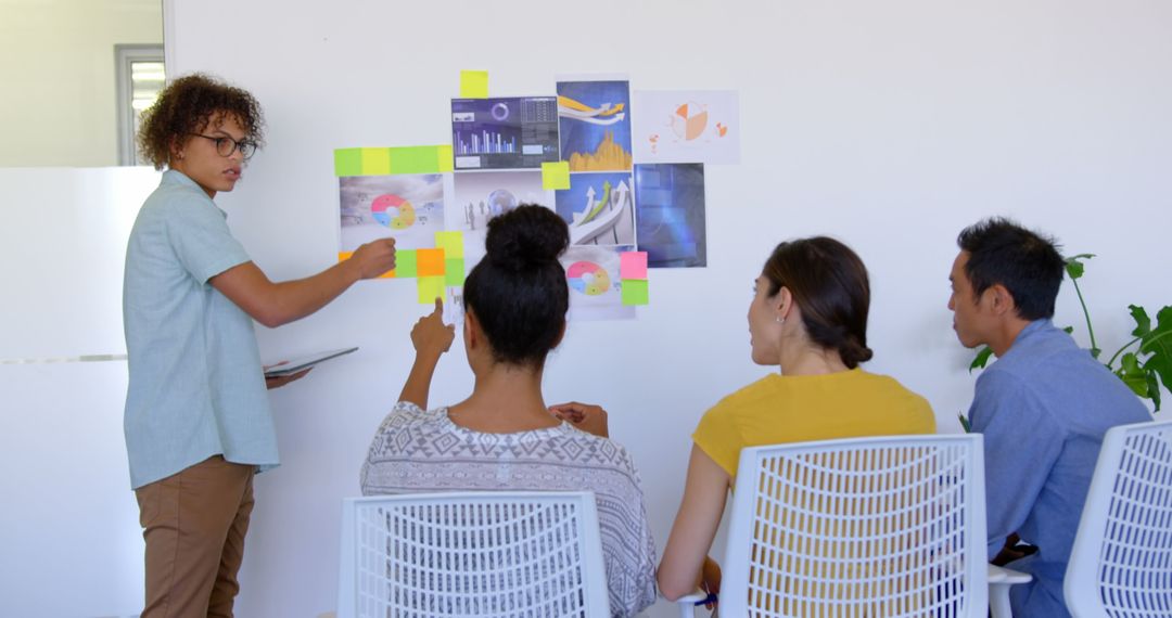 Diverse Team Engaged in Collaborative Office Presentation