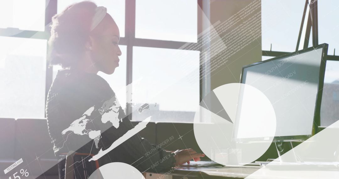 Businesswoman Analyzing Data on Computer in Sunny Office