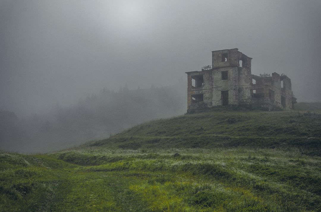 Abandoned Building on Foggy Hill in Misty Countryside - Free Images, Stock Photos and Pictures on Pikwizard.com