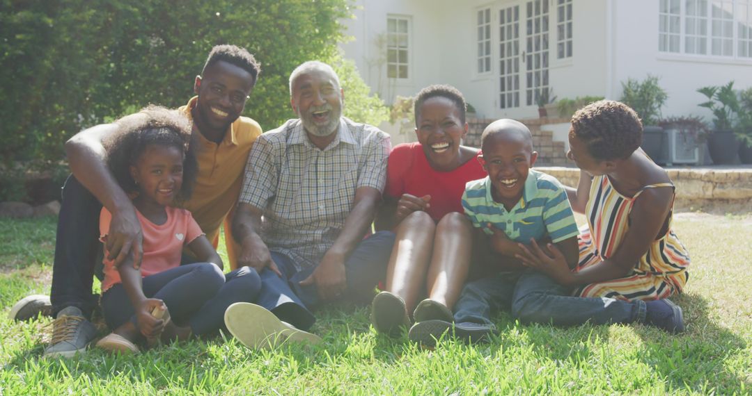 Happy Multigenerational Family Relaxing in Backyard Garden