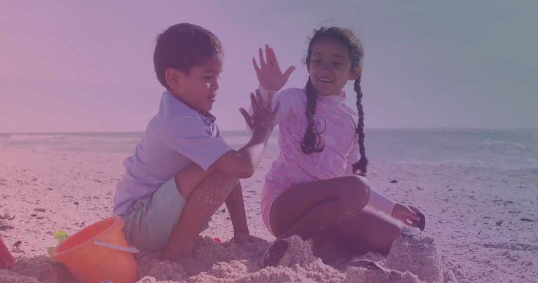 Siblings Enjoying Bonding Time on Sunny Beach