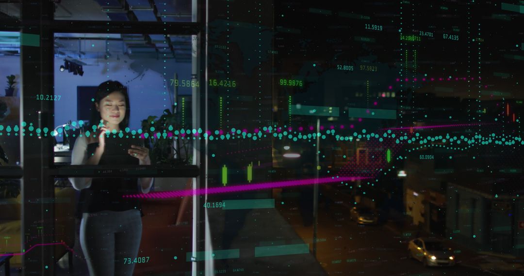 Asian Businesswoman Analyzing Data with Interactive Projections in Modern Office