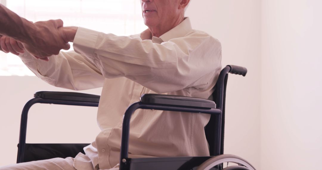 Elderly Man in Wheelchair Receiving Assistance - Free Images, Stock Photos and Pictures on Pikwizard.com