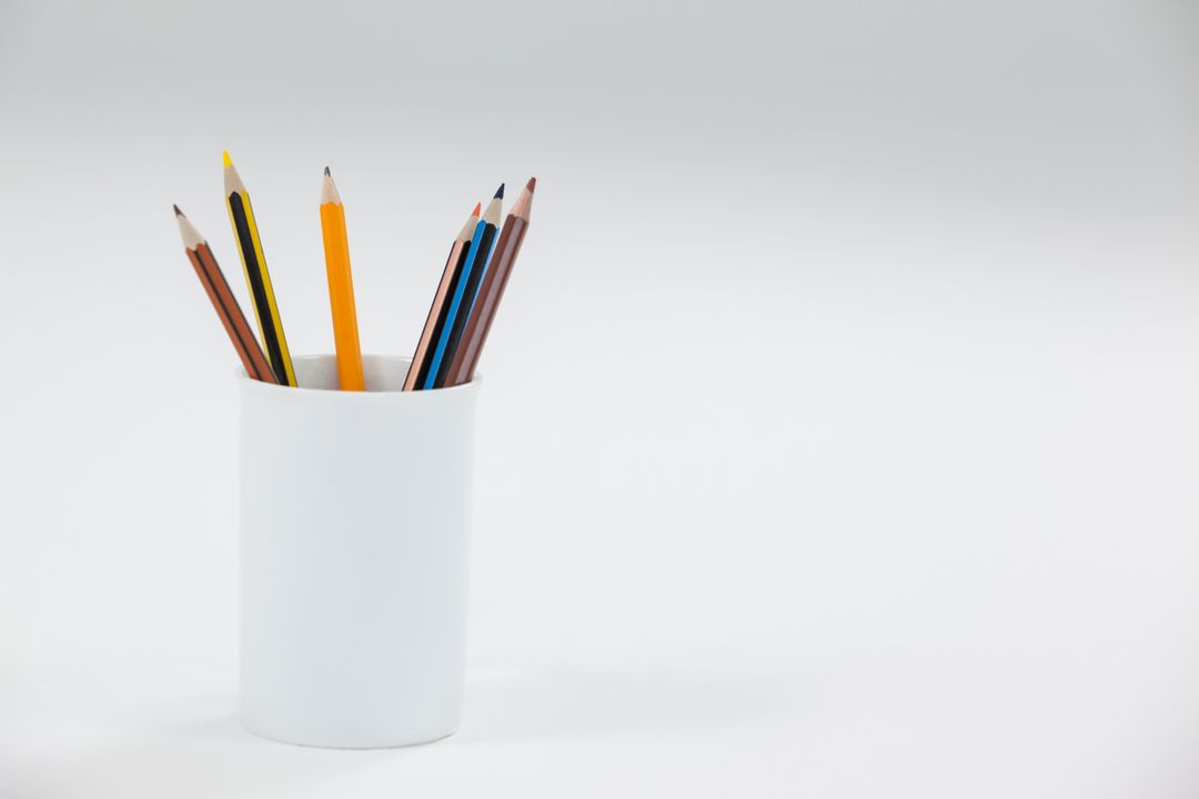 Colored Pencils in White Cup on White Background - Free Images, Stock Photos and Pictures on Pikwizard.com