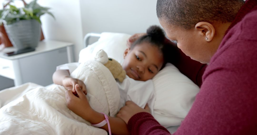 Concerned Parent Comforting Sick Child in Hospital Bed - Free Images, Stock Photos and Pictures on Pikwizard.com