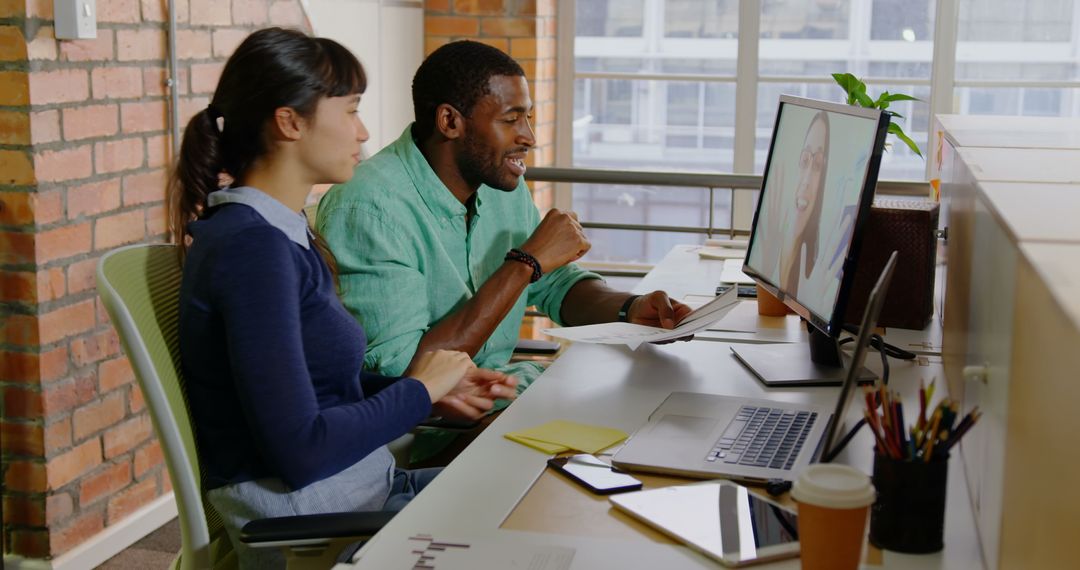 Diverse Team Collaborating in Bright Modern Office on Video Call