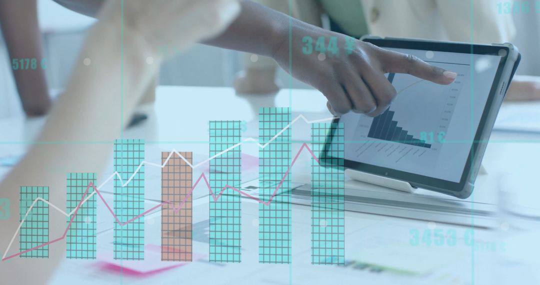 Diverse Businesswomen Analyzing Financial Growth Chart on Tablet