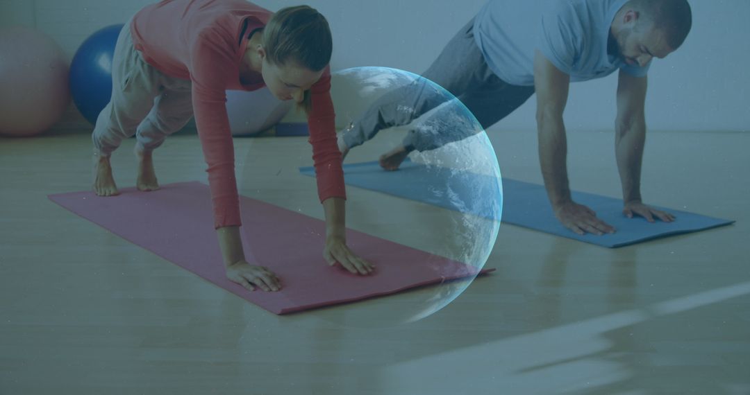 Caucasian Couple Practicing Yoga Together in Studio