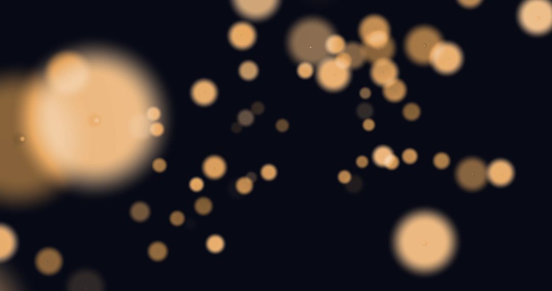 Glowing Orange Light Spots on Black Background