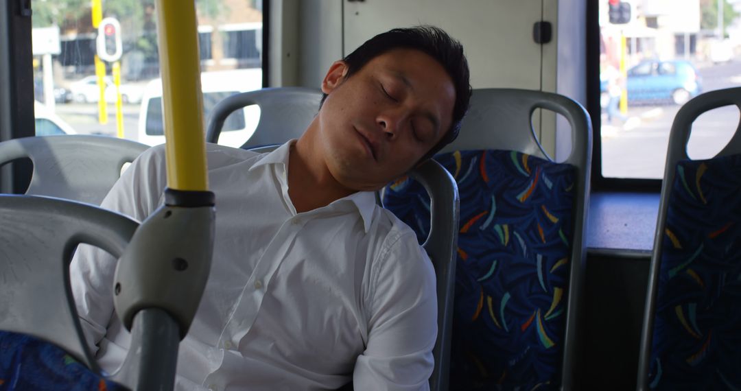 Man Sleeping on Public Bus in Daylight - Free Images, Stock Photos and Pictures on Pikwizard.com