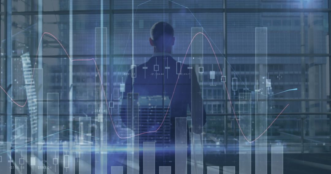 Businessman Overlooking Financial Graphs and Charts in Office