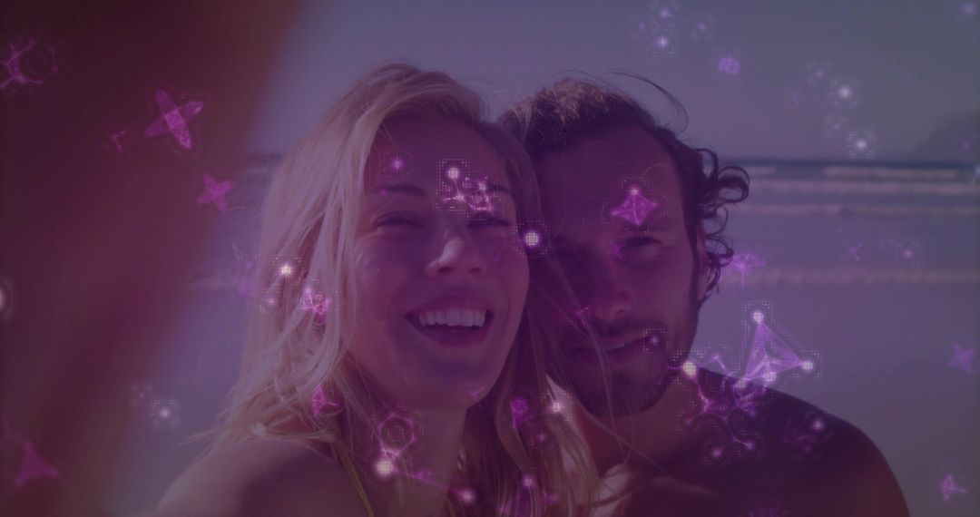 Smiling Couple on Beach with Superimposed Constellations and Waves