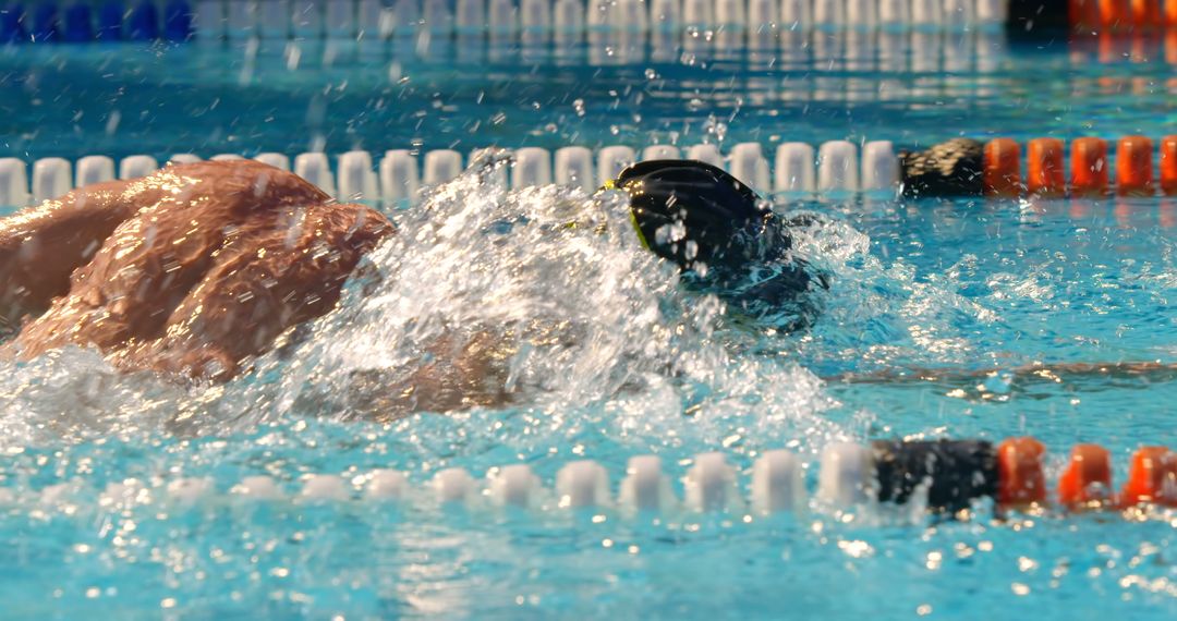 Professional Swimmer Competing in a Freestyle Race - Free Images, Stock Photos and Pictures on Pikwizard.com