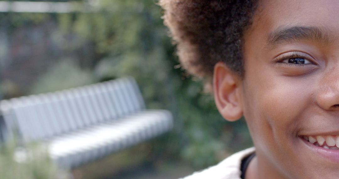 Half Portrait of Smiling Child in Garden