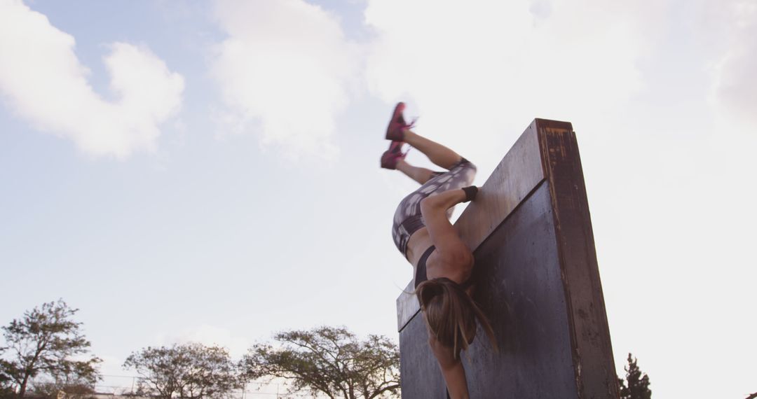 Athletic Woman Overcoming Obstacle in Outdoor Challenge - Free Images, Stock Photos and Pictures on Pikwizard.com