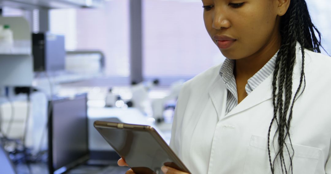 Female Scientist Using Digital Tablet in Research Laboratory - Free Images, Stock Photos and Pictures on Pikwizard.com