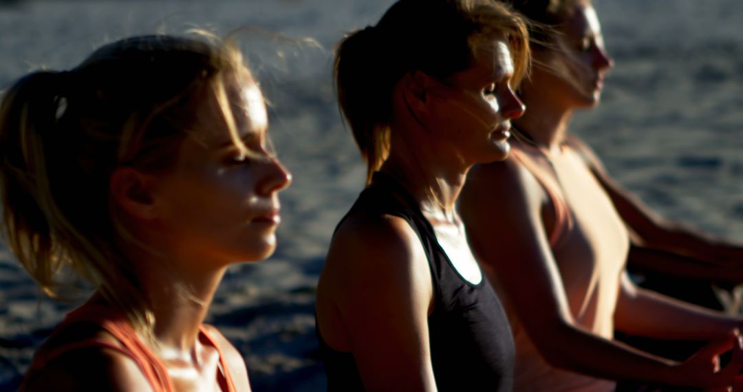 Women Meditating on Beach at Sunset - Free Images, Stock Photos and Pictures on Pikwizard.com