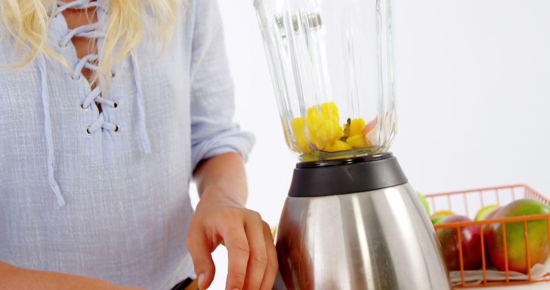 Woman Preparing Fresh Smoothie with Blender and Fruits - Free Images, Stock Photos and Pictures on Pikwizard.com